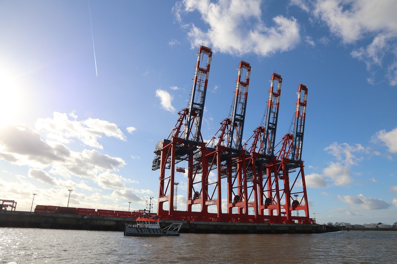 a large crane sitting on top of a body of water, by Werner Gutzeit, shutterstock, river thames, shipping docks, 3/4 view from below, 4k photo”