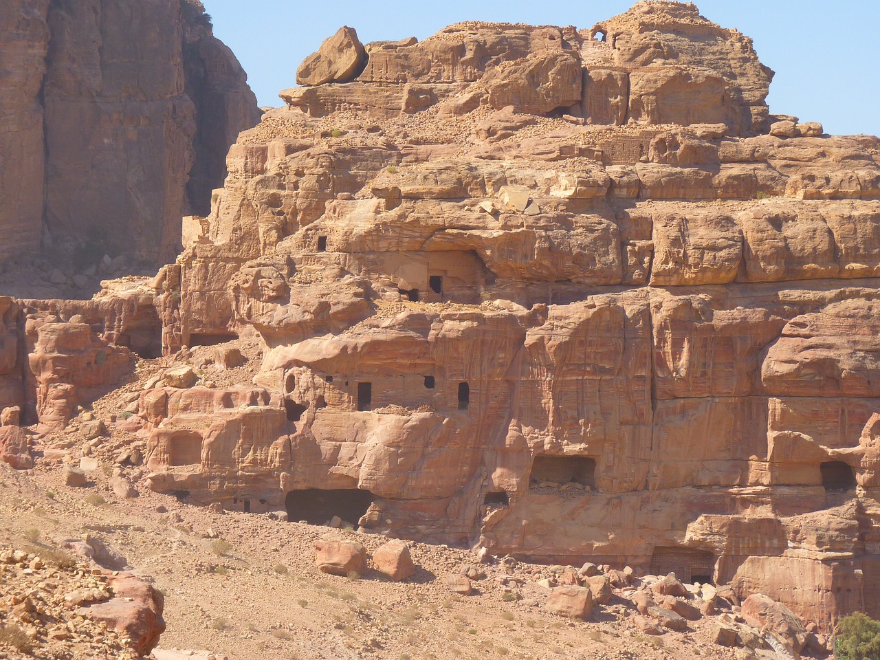 a group of people standing on top of a mountain, a detailed matte painting, mud and brick houses, wadi rum, ruined subdivision houses, cave drawings