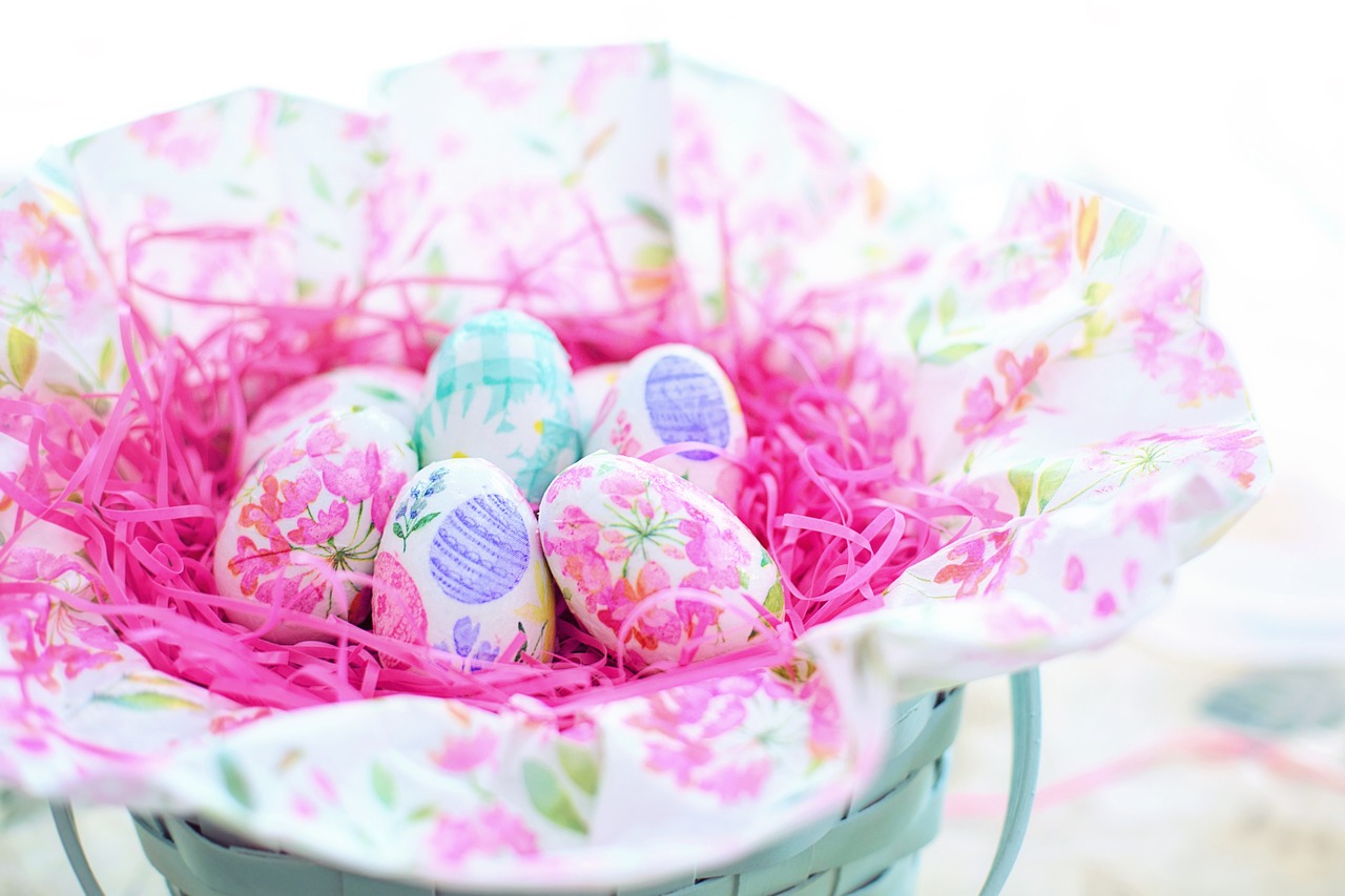 a basket filled with easter eggs sitting on top of a table, a picture, by Lena Alexander, pexels, pink white turquoise, flowery wallpaper, pink and purple, 3 4 5 3 1