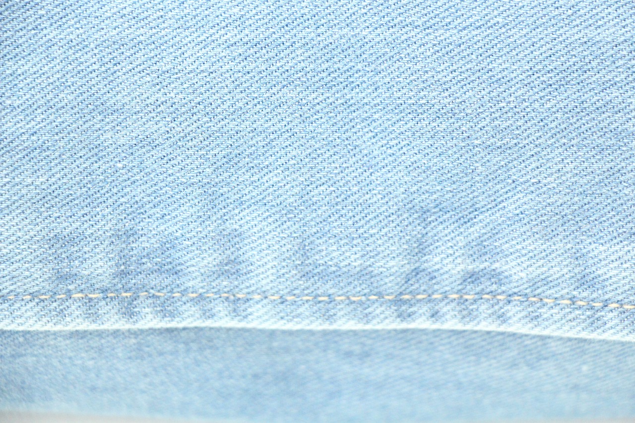 a close up of a pair of blue jeans, a screenshot, inspired by Saitō Kiyoshi, ultra high pixel detail, detailed photo of an album cover, pale blue backlight, realistic fabric