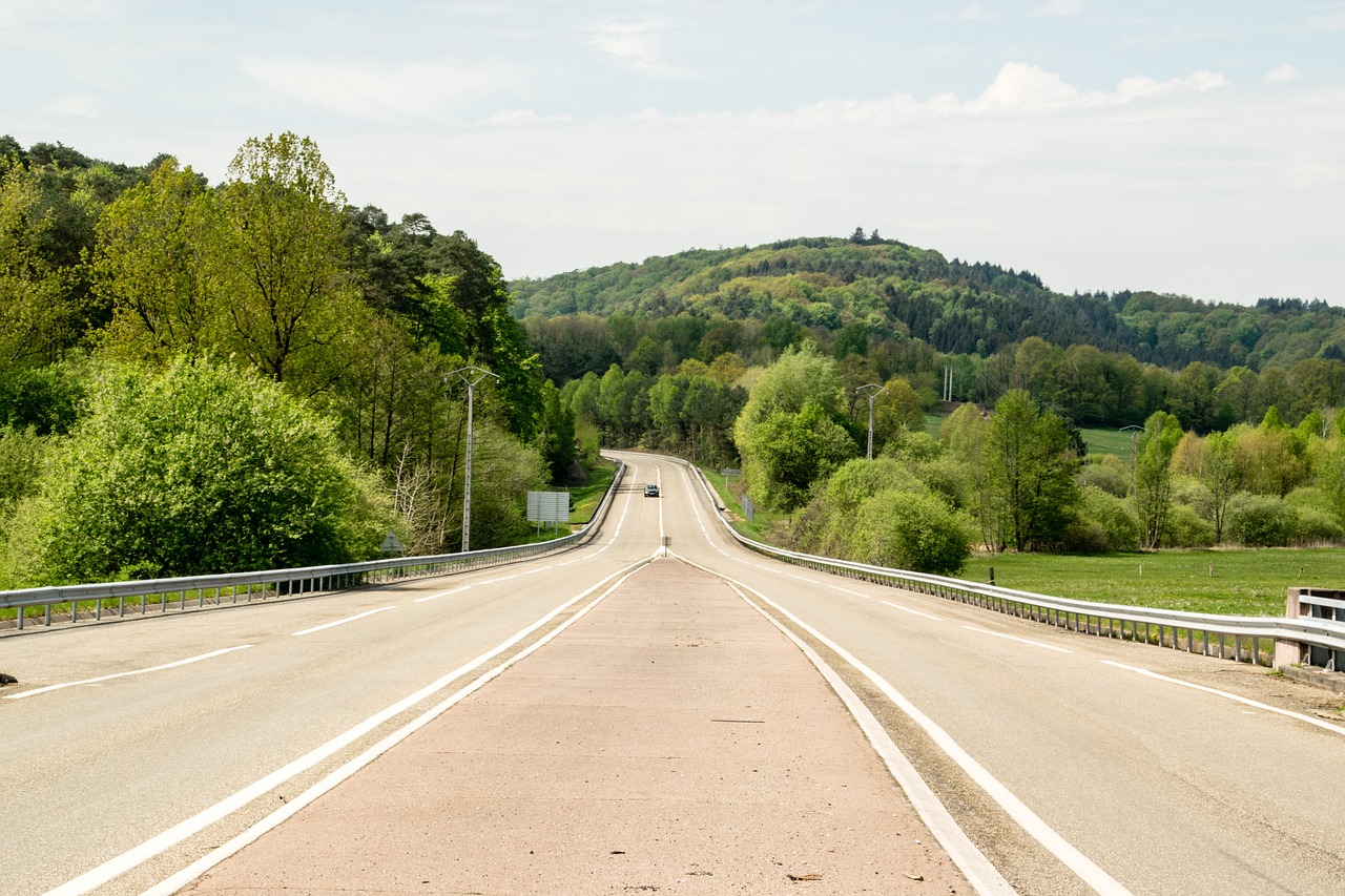 a highway with a mountain in the background, a stock photo, by Matthias Stom, shutterstock, lower saxony, high detail photo of a deserted, detmold, open top