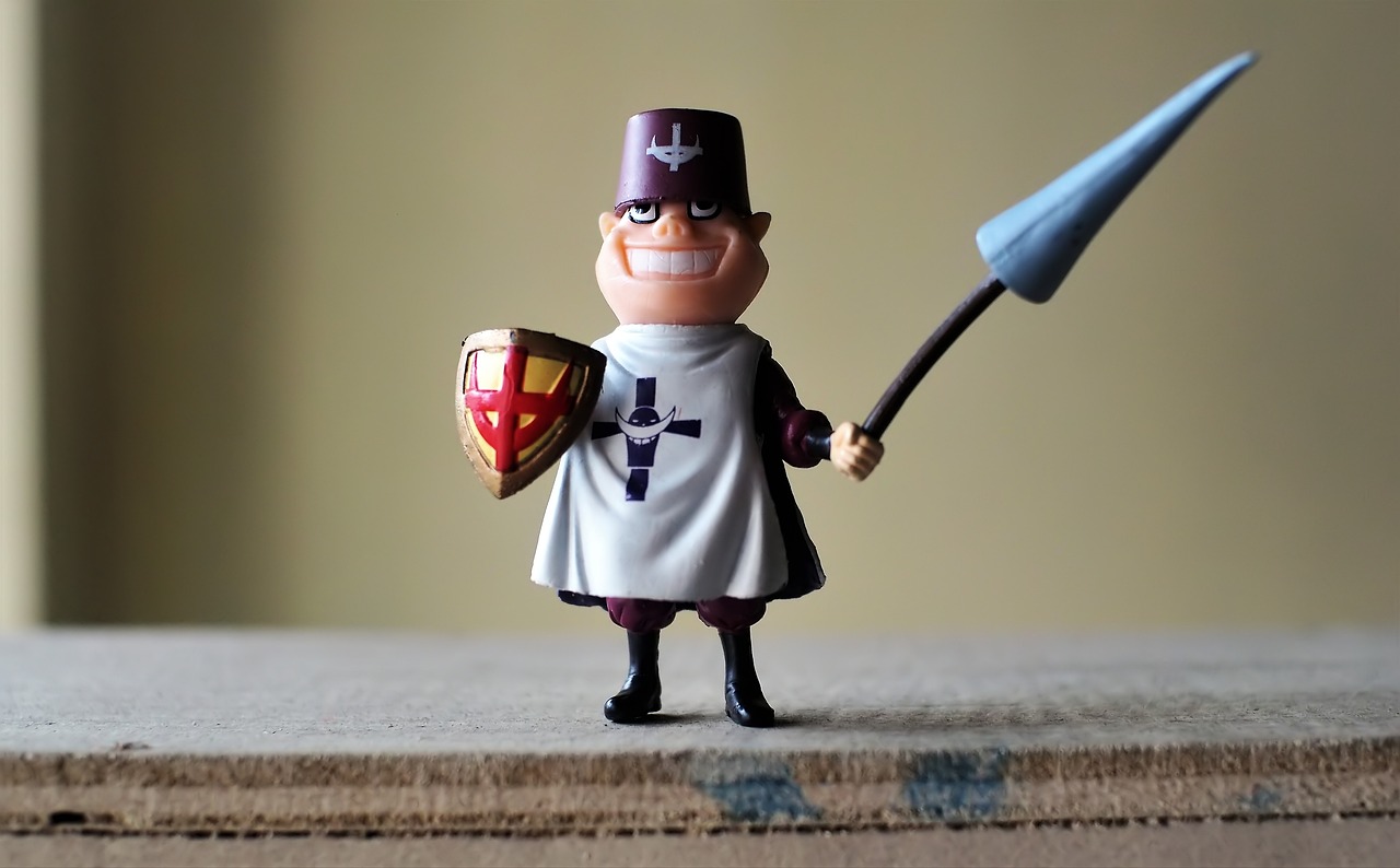 a figurine of a knight holding a sword and shield, a picture, unsplash, neo-dada, hamburglar, peter griffin, nendroid, holy crusader