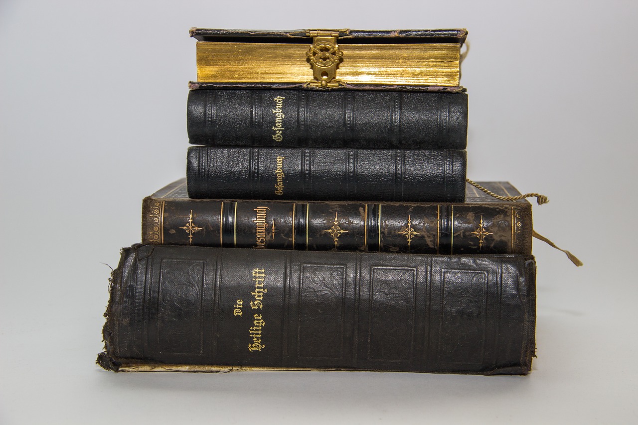 a stack of books sitting on top of each other, a portrait, by Wilhelm Bendz, leather, religious composition, black, four