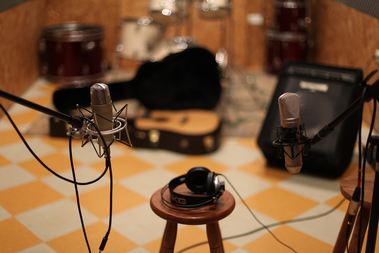 a group of microphones sitting on top of a table, flickr, realism, in his basement studio, guitar, kyoto studio, high quality image”