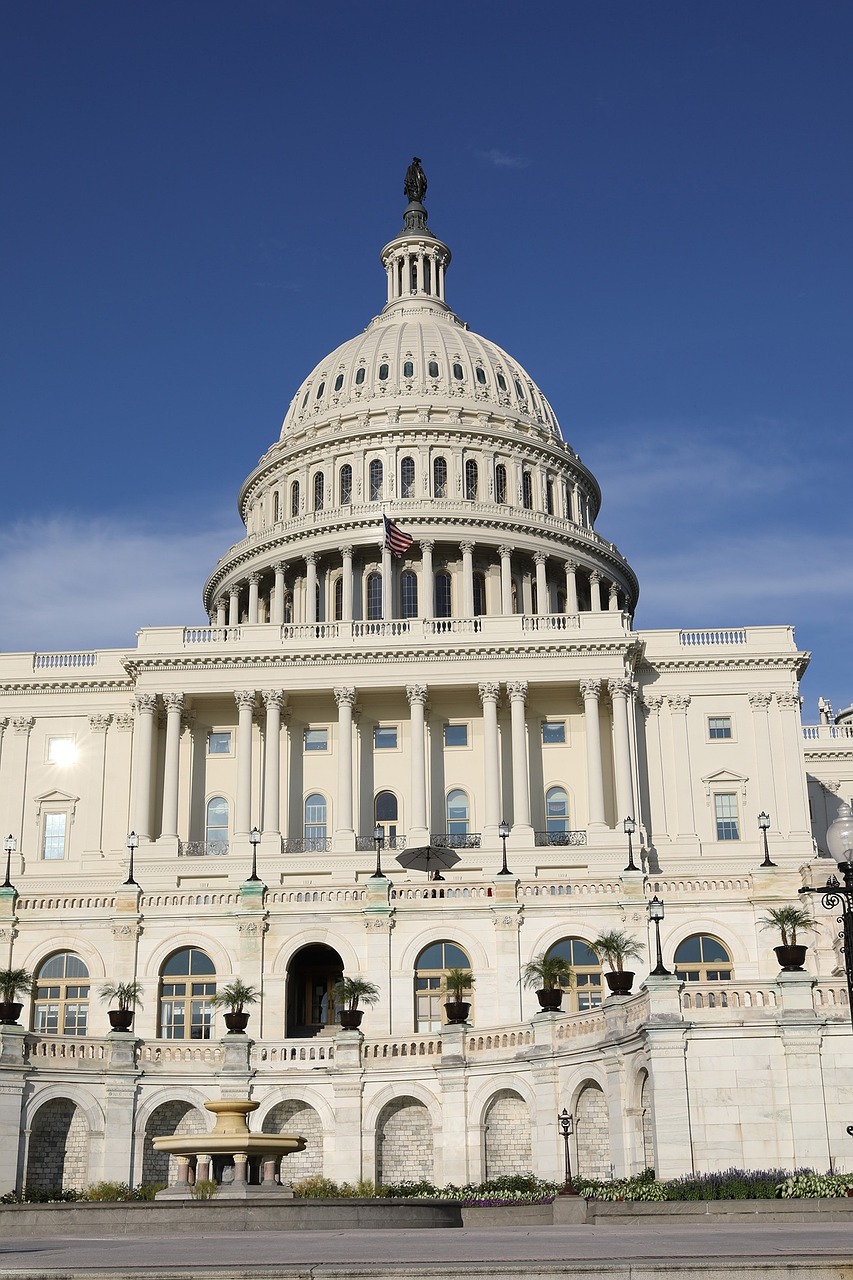 a large white building with a clock on top of it, a picture, by Tom Carapic, shutterstock, state of the union, afp, view from ground, official government photo