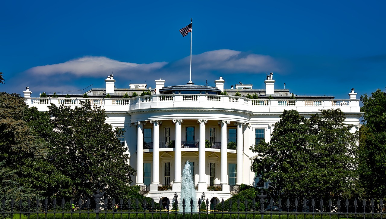 the white house with a fountain in front of it, by Douglas Shuler, shutterstock, 🦩🪐🐞👩🏻🦳, blue sky, front face, luxury and elite