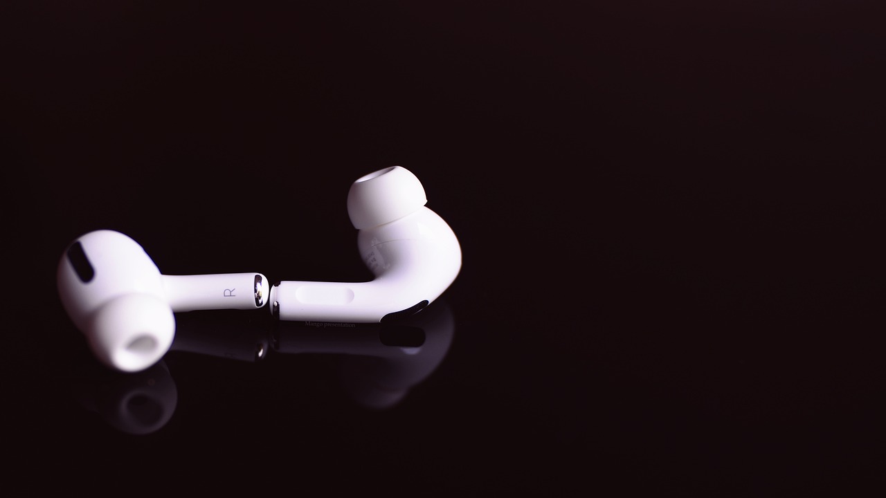 a pair of ear buds sitting on top of a black surface, inspired by Robert Mapplethorpe, hurufiyya, water pipe, glossy white, 王琛, 2 0 0 1