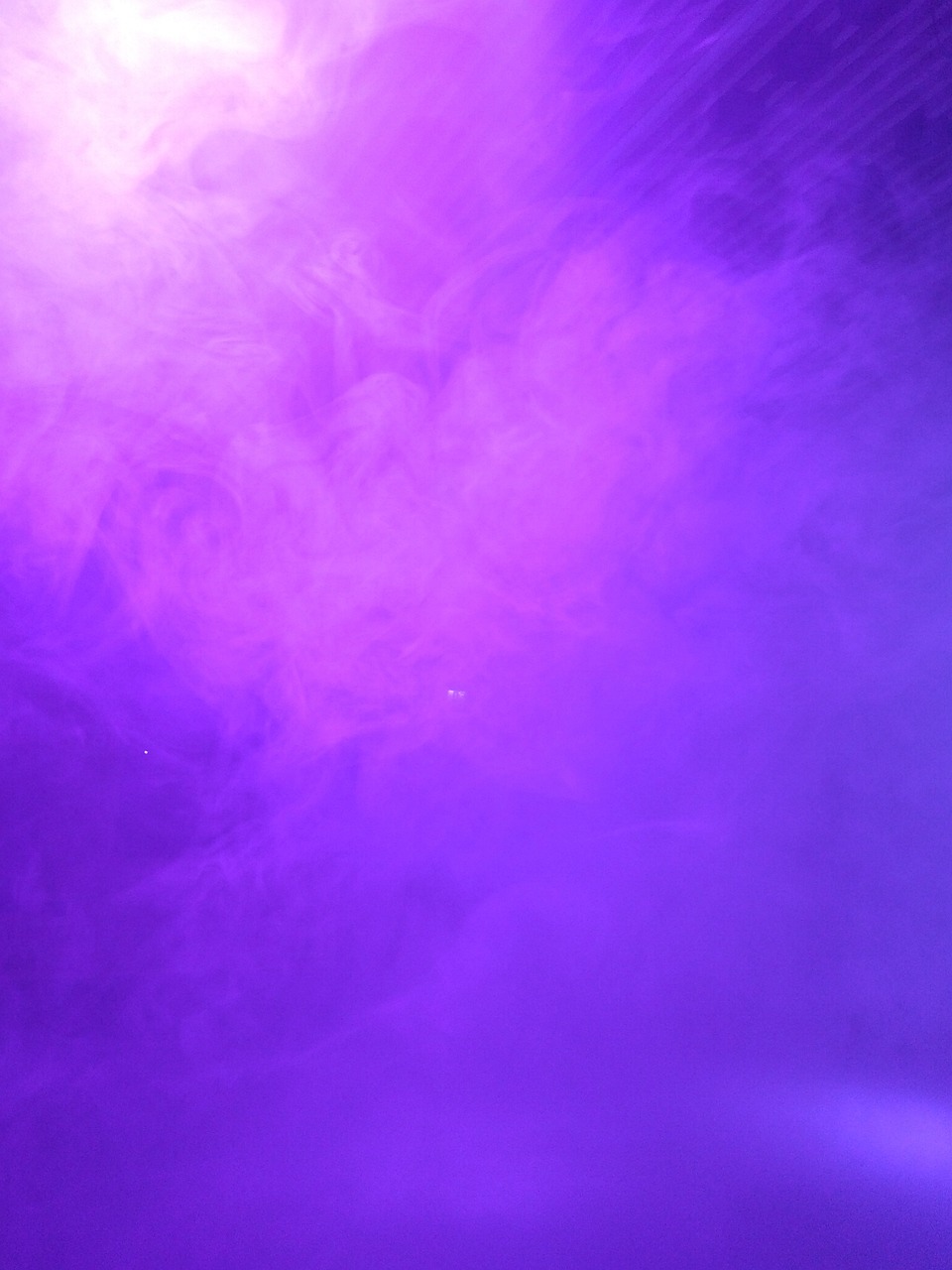 a close up of a purple smoke cloud, light and space, nightclub background, show from below, water fog, taken with a canon eos 5d