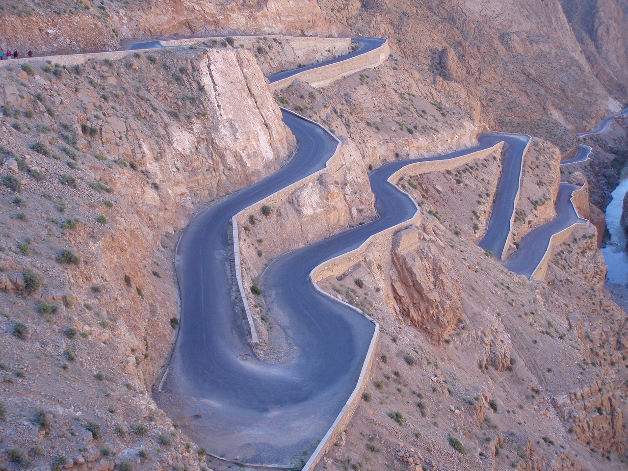 an aerial view of a winding mountain road, flickr, les nabis, al - qadim, author unknown, crazy detail, at dusk!