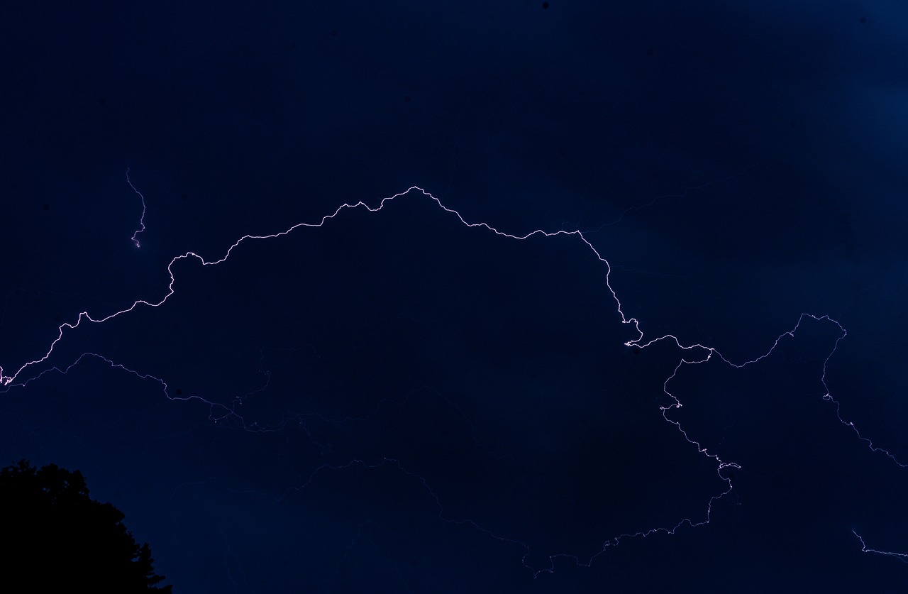 a sky filled with lots of lightning next to trees, by Jan Rustem, flickr, hurufiyya, mariana trench, zoomed out view, outline glow, laos