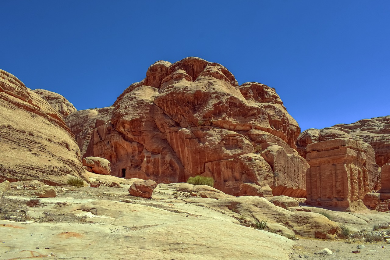 a large rock formation in the middle of a desert, les nabis, hdr detail, buddhist monastery on mars, ancient libu princess, red fluid on walls of the church