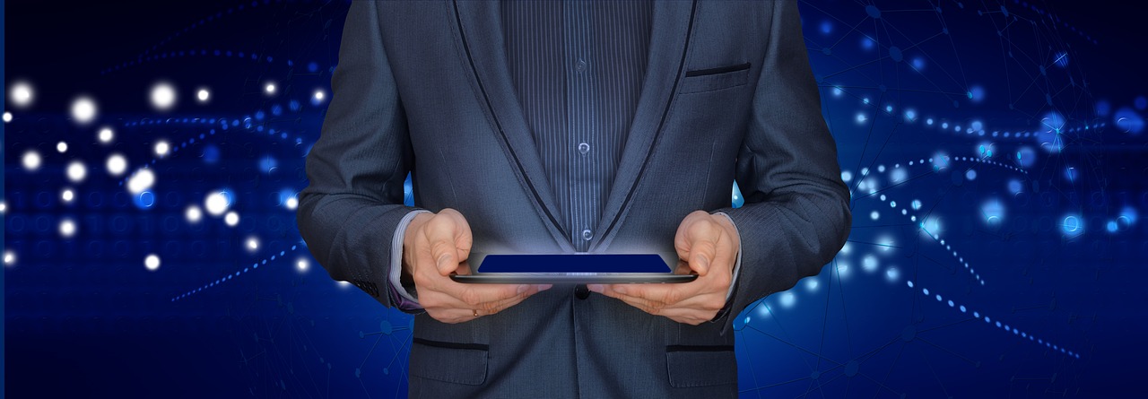 a man in a suit holding a tablet computer, pixabay, tech robes, mobile app, performance, computer - generated
