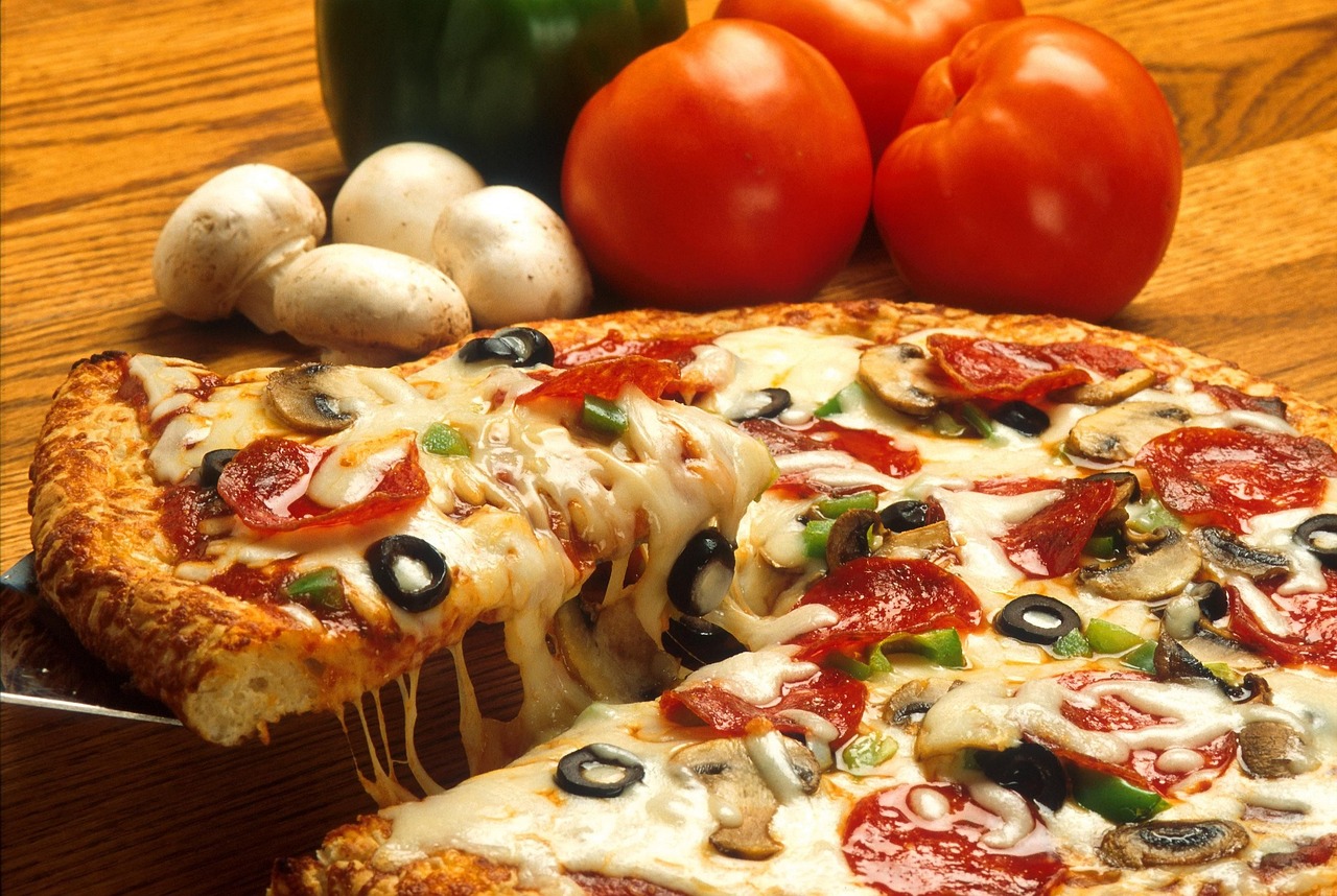 a pizza sitting on top of a wooden table, a picture, by Arthur Pan, realism, h 768, high grain, veggies, sales