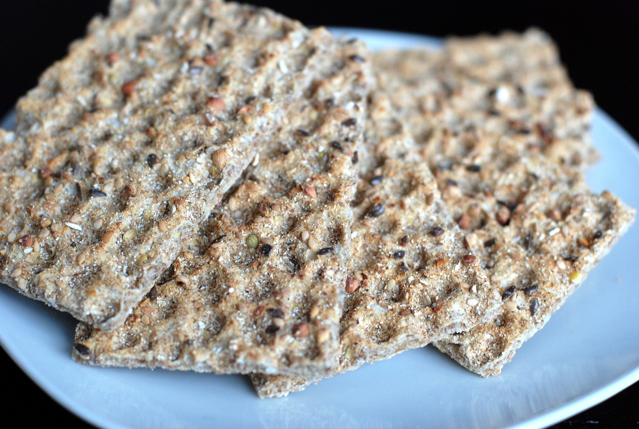 a white plate topped with crackers on top of a table, dau-al-set, natural grizzled skin, hemp, broad detail, square