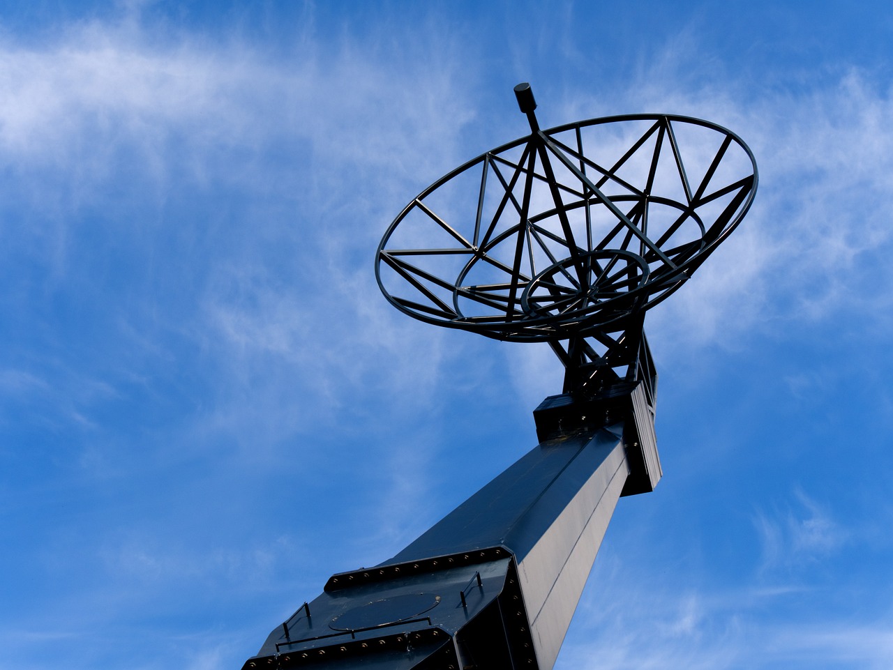 a satellite dish sitting on top of a metal pole, by John Murdoch, shutterstock, elstree, reaching for the sky, on display, halo array