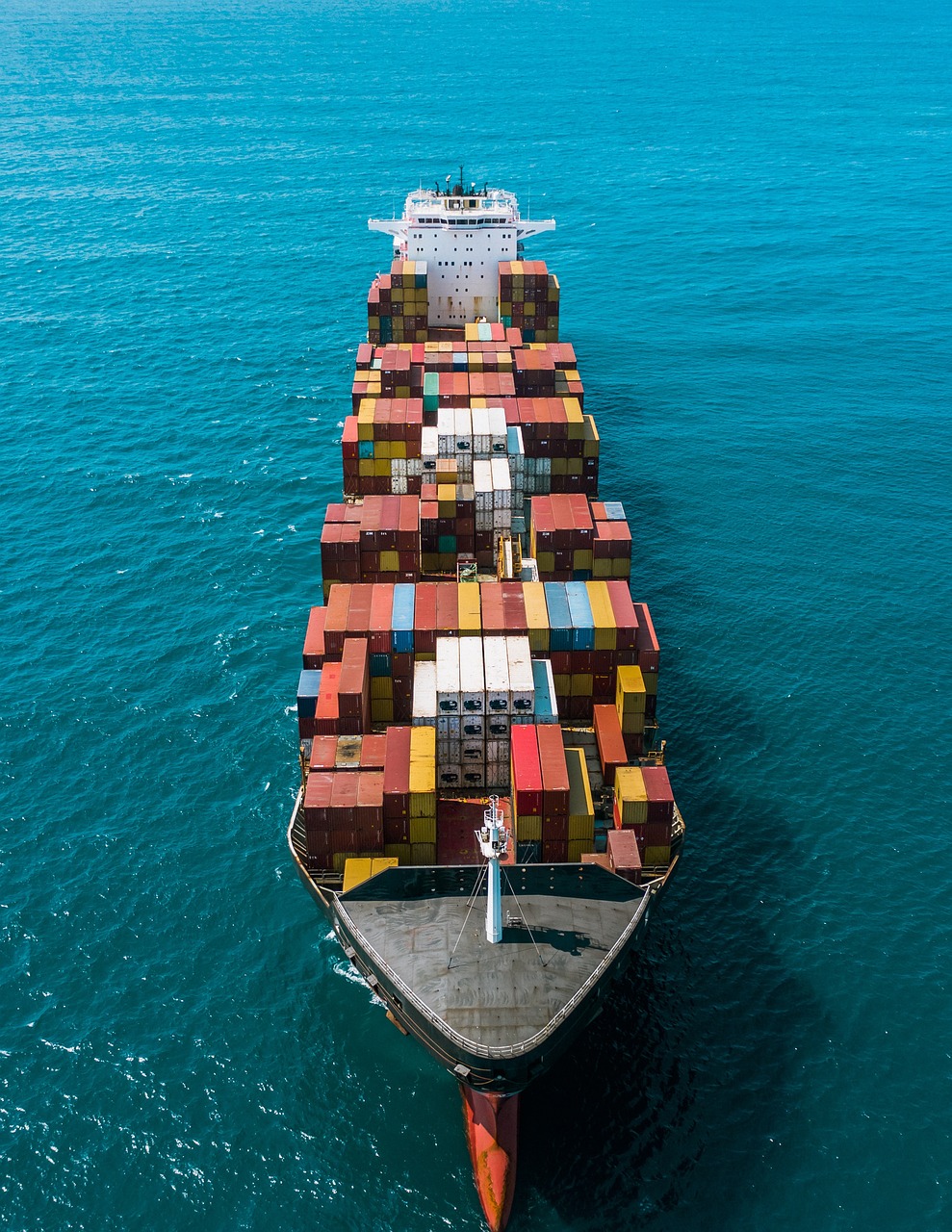 a large container ship in the middle of the ocean, a portrait, by Richard Carline, top down perspecrive, ergonomic, beginner, still photography