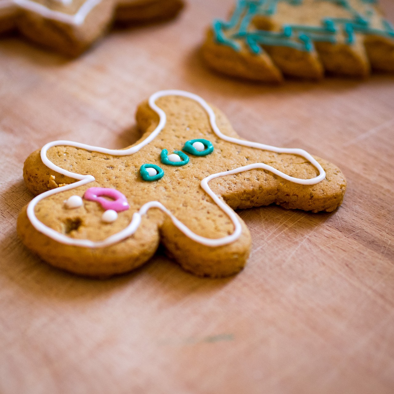 a close up of some cookies on a table, by David Garner, pexels, naive art, gingerbread people, taken with sony a7r camera, with ornamental edges, stock photo