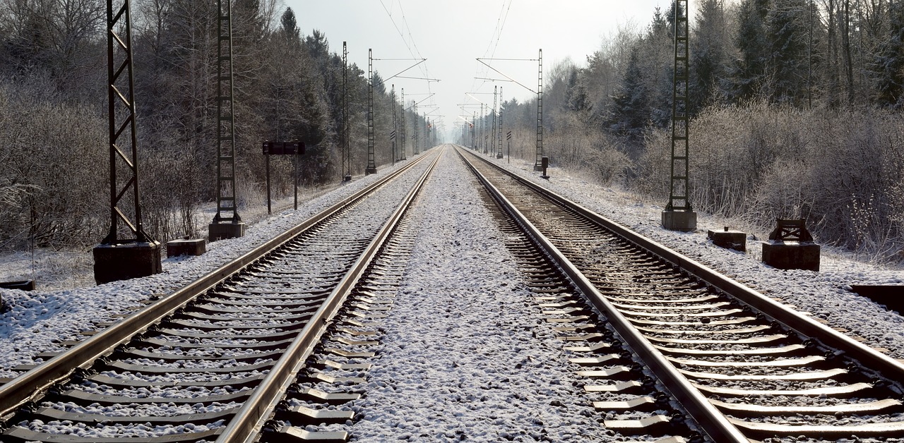 a couple of train tracks that are next to each other, a portrait, by Werner Gutzeit, flickr, regionalism, dusting of snow, 2000s photo, pristine and clean, high detail 1024