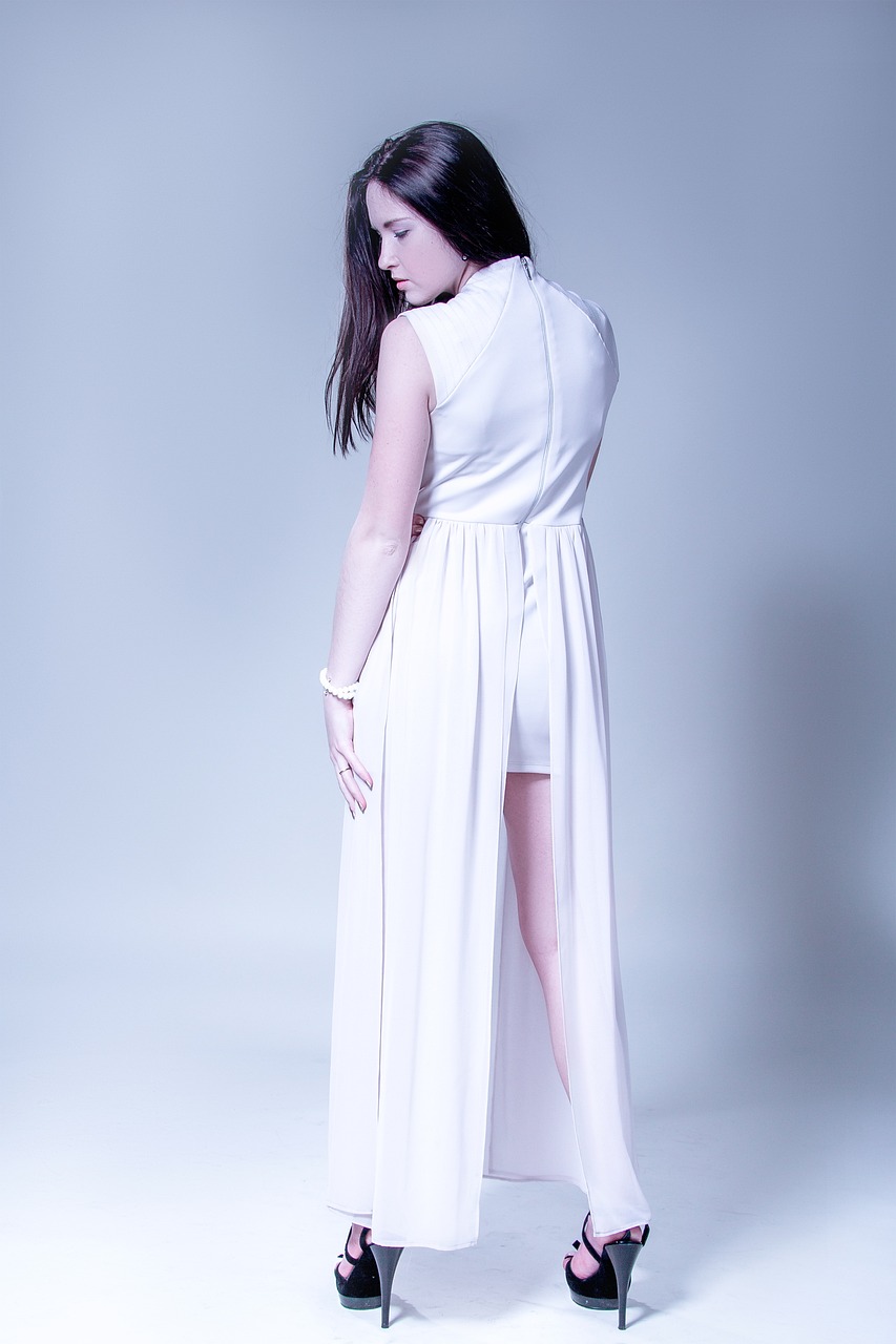 a woman in a white dress posing for a picture, inspired by Esaias Boursse, tumblr, professional studio photography, rear-shot, product introduction photo, jumpsuit
