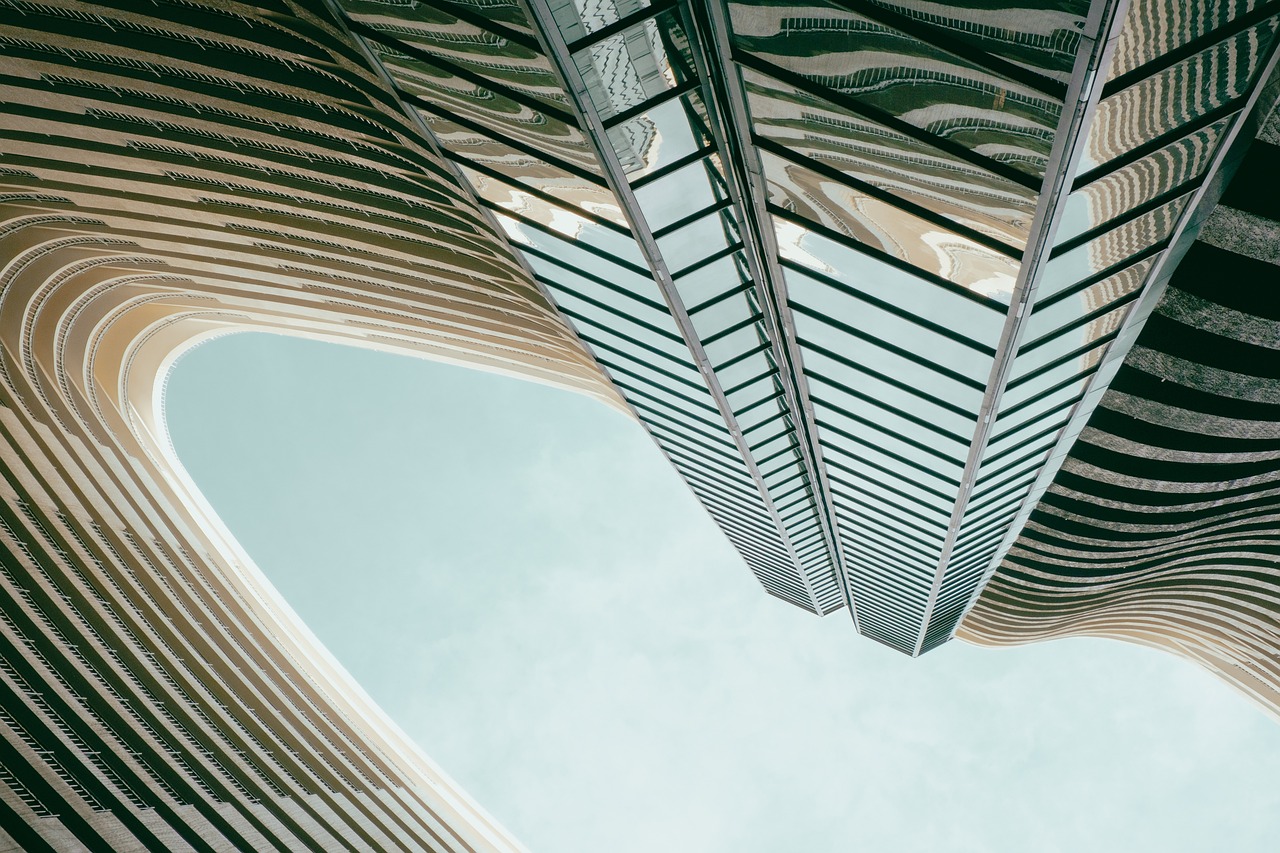 a very tall building with a lot of windows, a picture, inspired by Zaha Hadid, unsplash contest winner, canopies, a pair of ribbed, laquer and steel, fine swirling lines