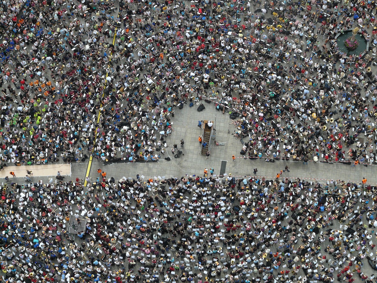 an aerial view of a large crowd of people, a photo, by Liang Kai, conceptual art, praying, beijing, musician, ap news photo