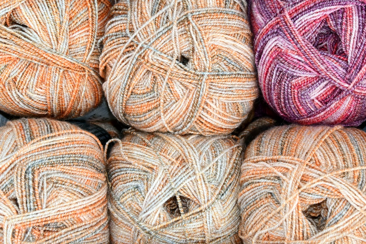 a pile of balls of yarn sitting on top of each other, pexels, fine art, pale orange colors, full of colour 8-w 1024, centre image, egypt