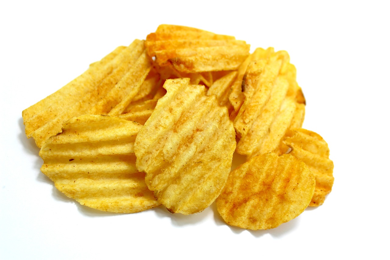 a pile of potato chips on a white surface, a picture, renaissance, product introduction photo, crisp hd image, food blog photo, close-up shot taken from behind