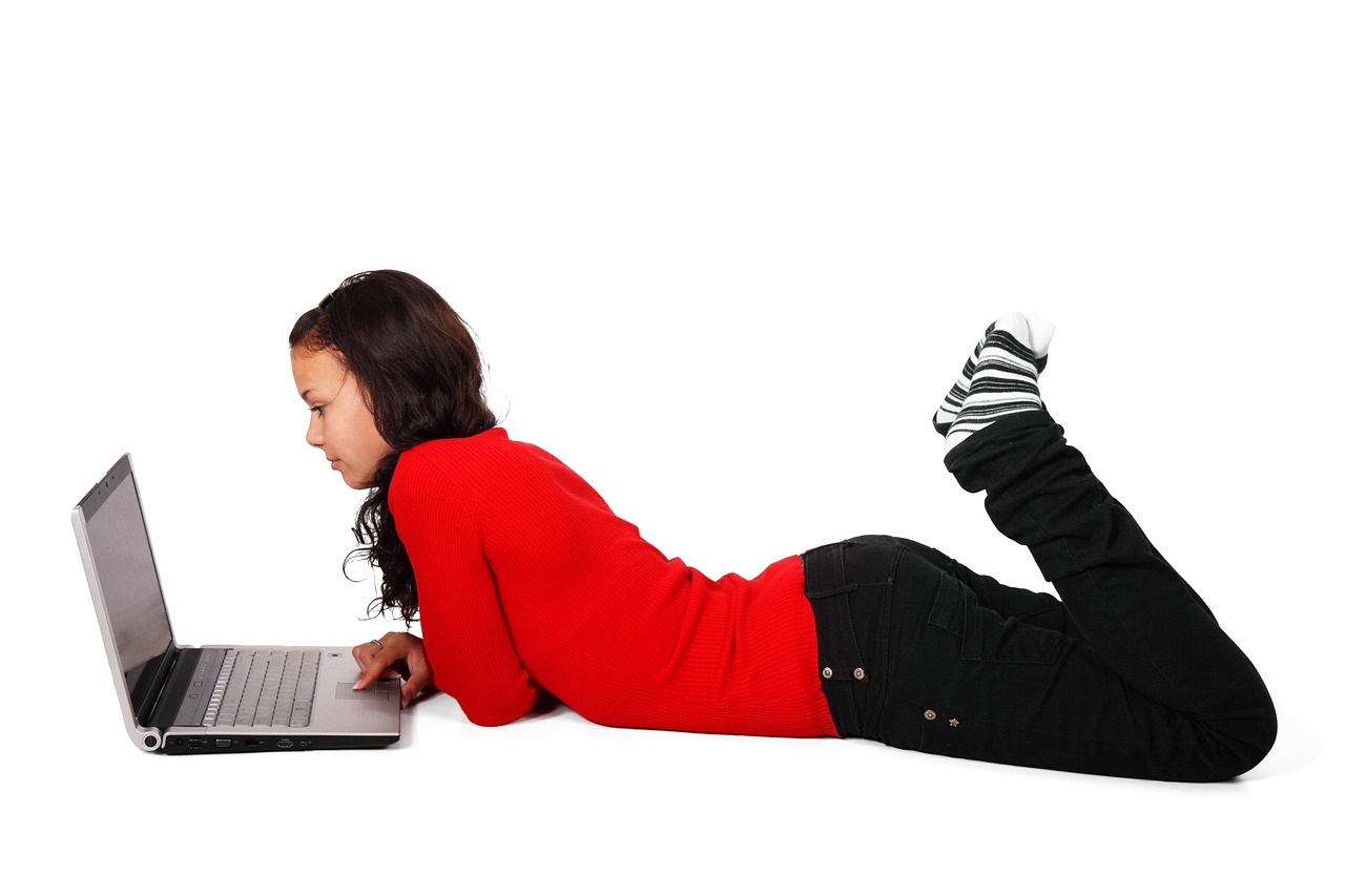 a woman laying on the floor with a laptop, by Ella Guru, pixabay, long hair and red shirt, black teenage girl, fullbody photo, on white background