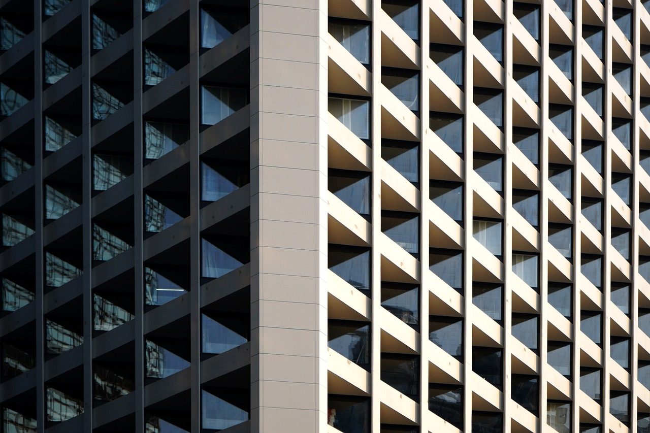 a close up of a tall building with many windows, inspired by Ned M. Seidler, flickr, lattice, shot on 1 5 0 mm, great light and shadows”, australia