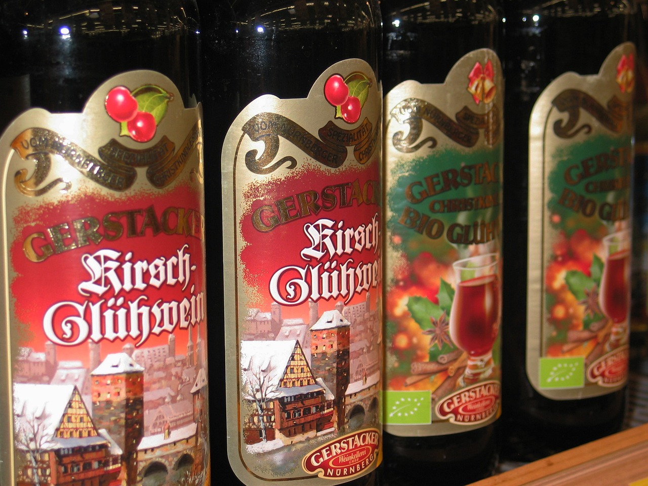 a row of bottles of cid sit on a shelf, a photo, by Werner Gutzeit, flickr, octoberfest, crimson, high angle close up shot, winter