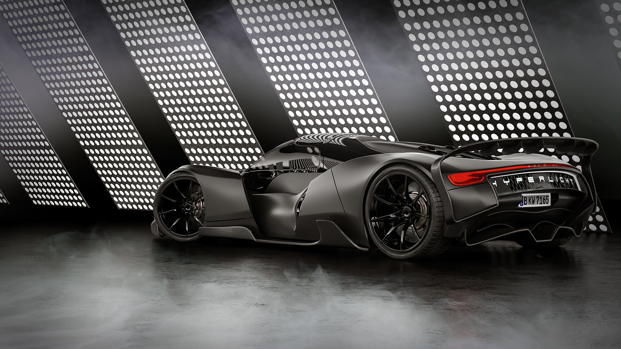 a close up of a sports car in a dark room, inspired by Darek Zabrocki, tumblr, conceptual art, badass batmobile car design, grey metal body, curving black, rear-shot