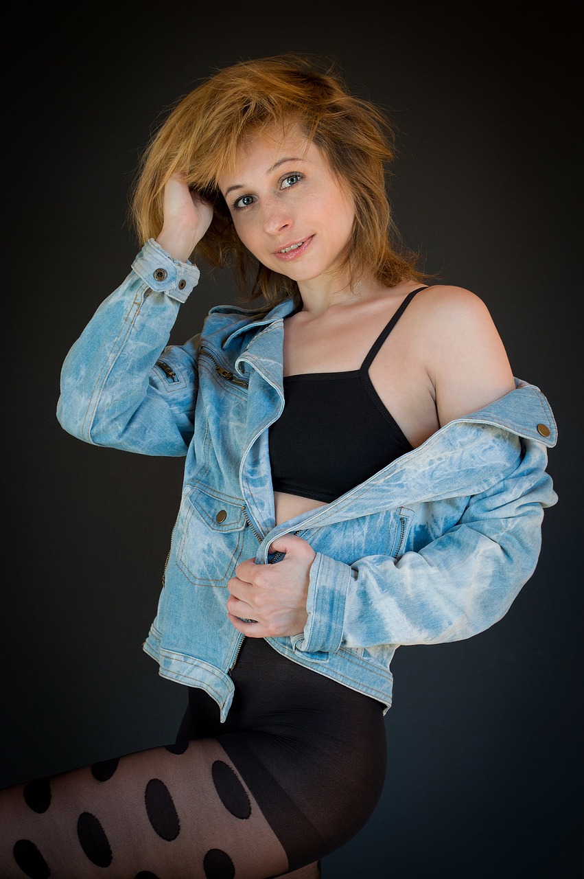 a woman in tights and a denim jacket, a portrait, inspired by Elizabeth Polunin, high exposure photo, studio portrait photo, 1 3 5 mm nikon portrait, chucky style