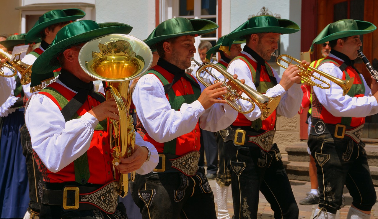 a group of men in green hats playing brass instruments, by Erwin Bowien, shutterstock, in spain, stock photo, traditional costume, lower saxony