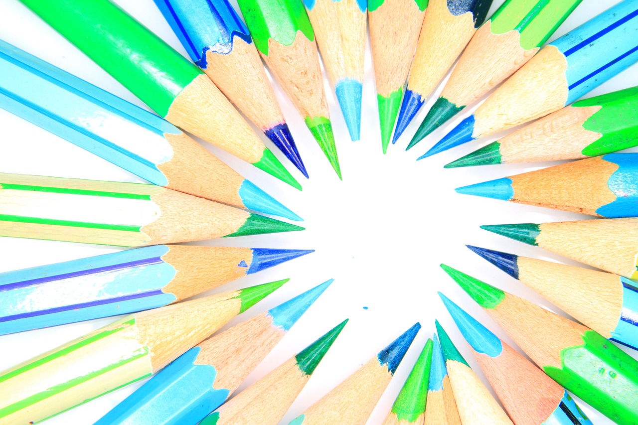 a group of colored pencils arranged in a circle, a picture, gradient white blue green, product introduction photo