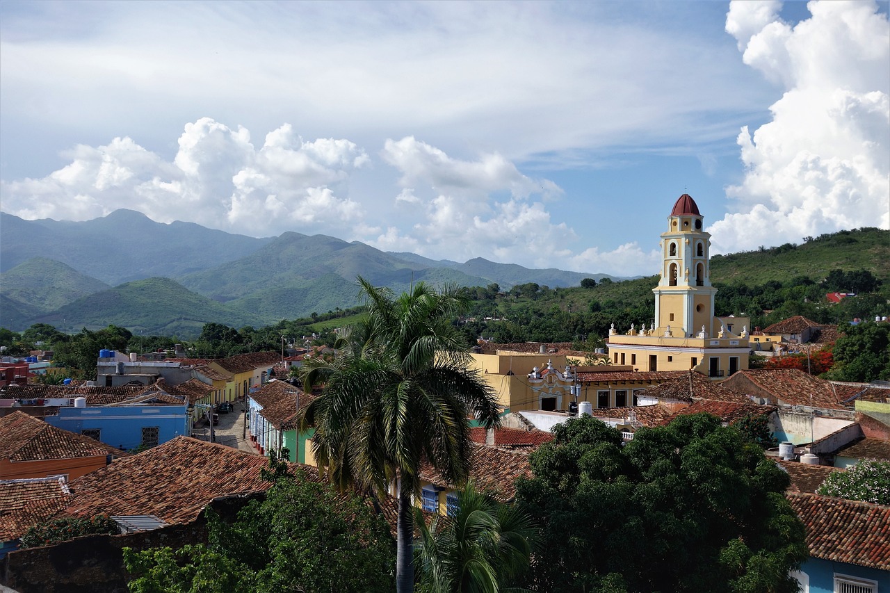 a view of a town with mountains in the background, inspired by Ceferí Olivé, cuba, skyline view from a rooftop, traditional, wikimedia