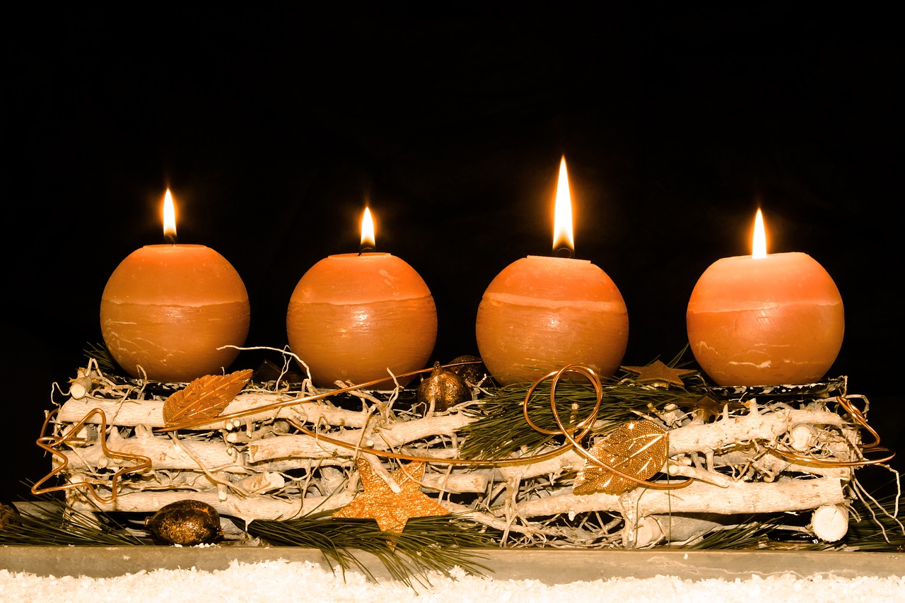 a bunch of candles sitting on top of a table, a photo, by Jesper Knudsen, shutterstock, wintertime, countdown, ocher, 555400831