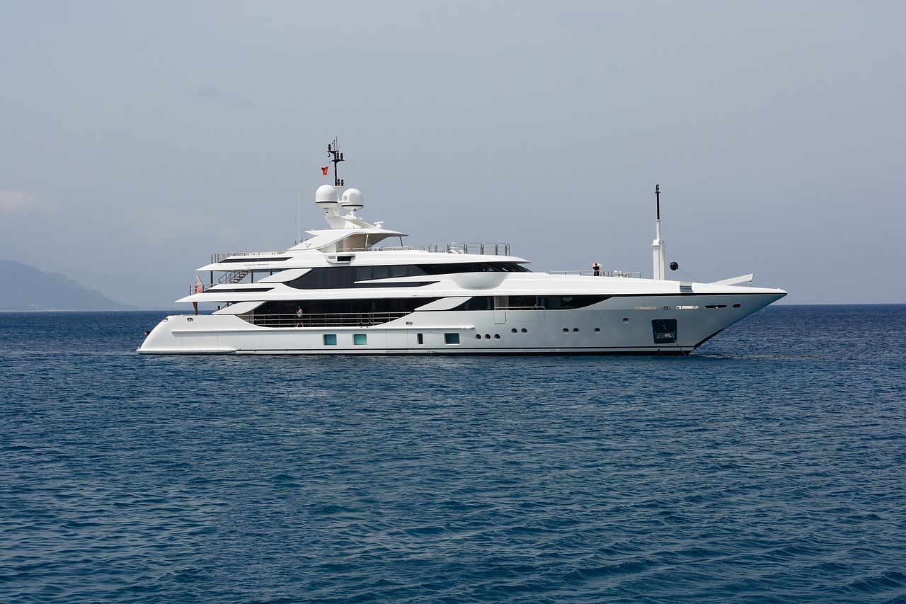 a large white boat in the middle of the ocean, on a super yacht, emma, petros, 3/4 side view