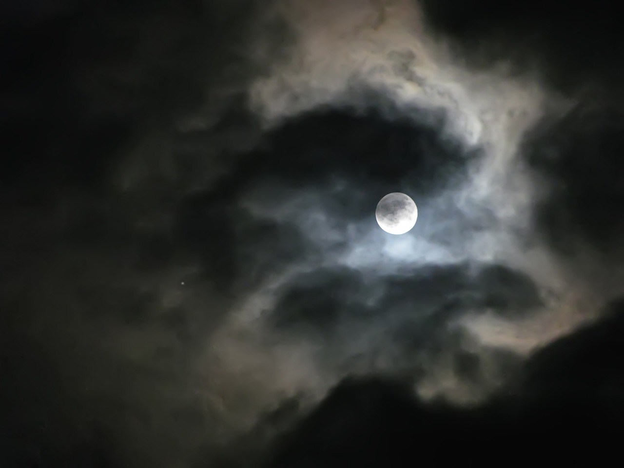 a full moon is seen through the clouds, a portrait, by Alexander Scott, flickr, dramatic nebula sky, night time footage