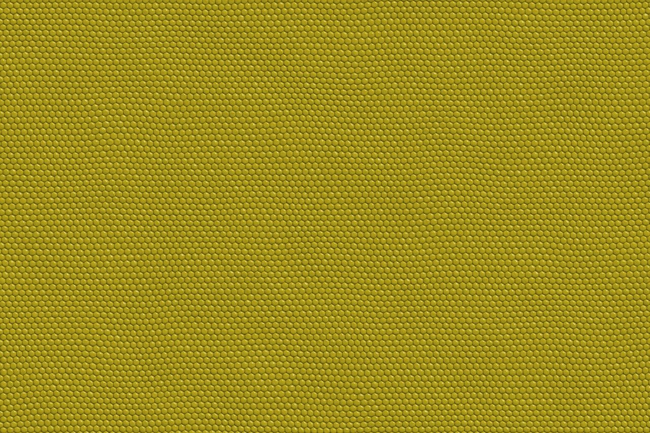 a close up of a yellow fabric, synthetism, tileable texture, lizard skin, rudolf béres, high resolution product photo