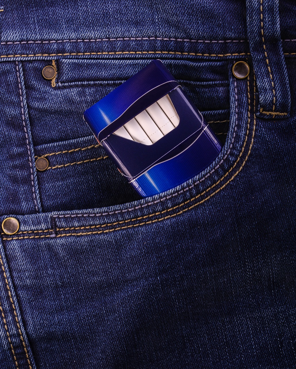 a toothbrush in the back pocket of a pair of jeans, a stock photo, by Orshi Drozdik, shutterstock, concept art zippo lighter, dark blue, angry smile, square jaw