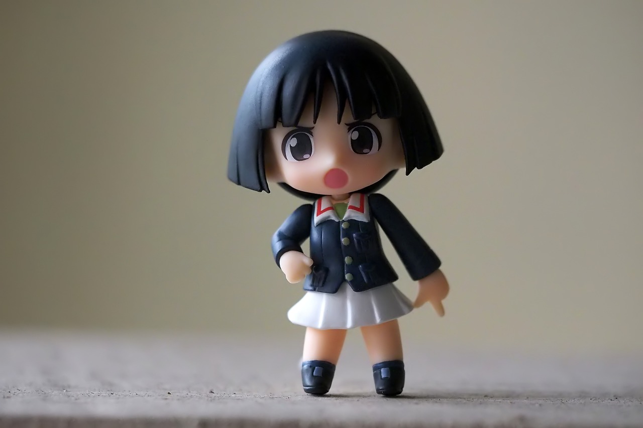 a close up of a small figurine of a girl, a picture, by Jin Homura, pexels, school uniform, plastic toy, with a bob cut, toy photo