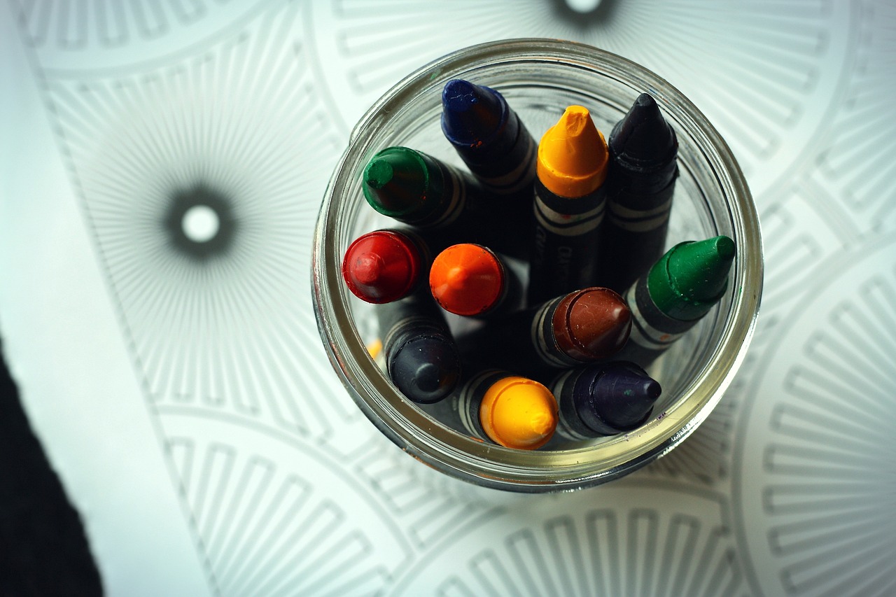 a jar filled with crayons sitting on top of a table, inspired by Doug Ohlson, shot from below, mandalas, deep colour\'s, full of colour 8-w 1024