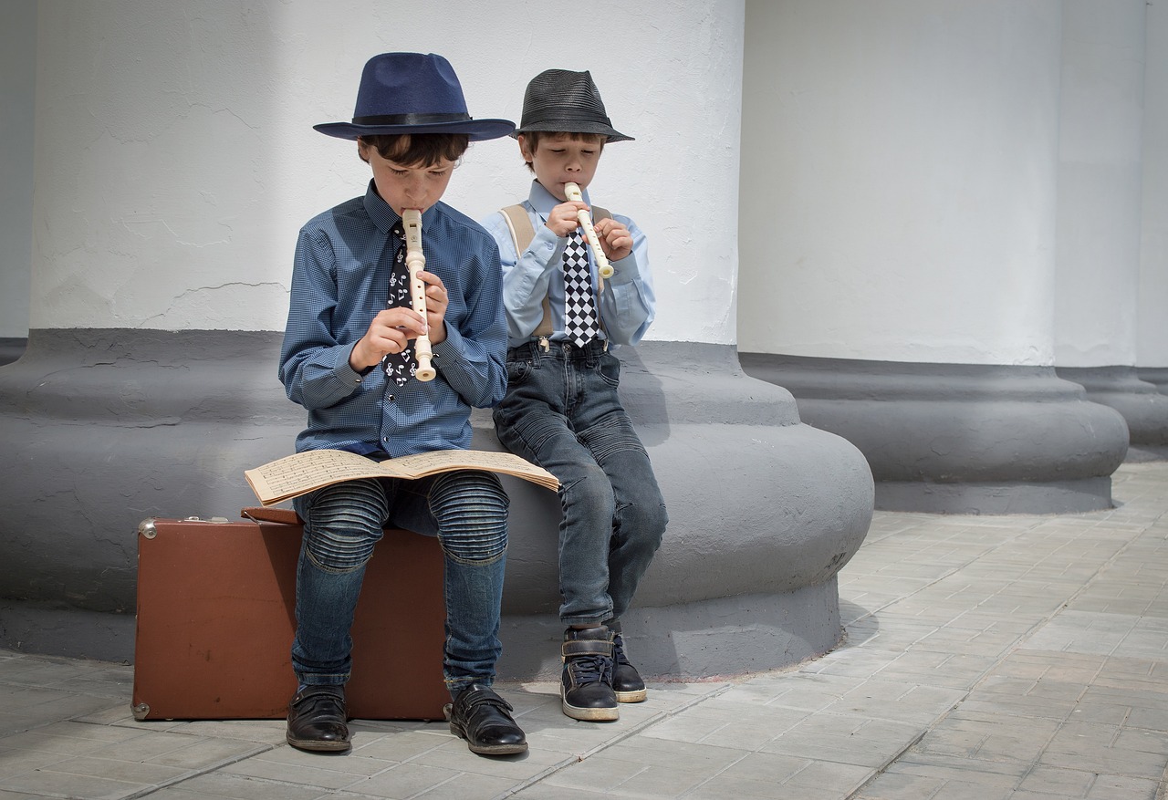 a couple of boys sitting next to each other on a bench, a picture, by Joze Ciuha, trending on pixabay, quito school, real saxophones, with straw hat, orthodox, duane hanson