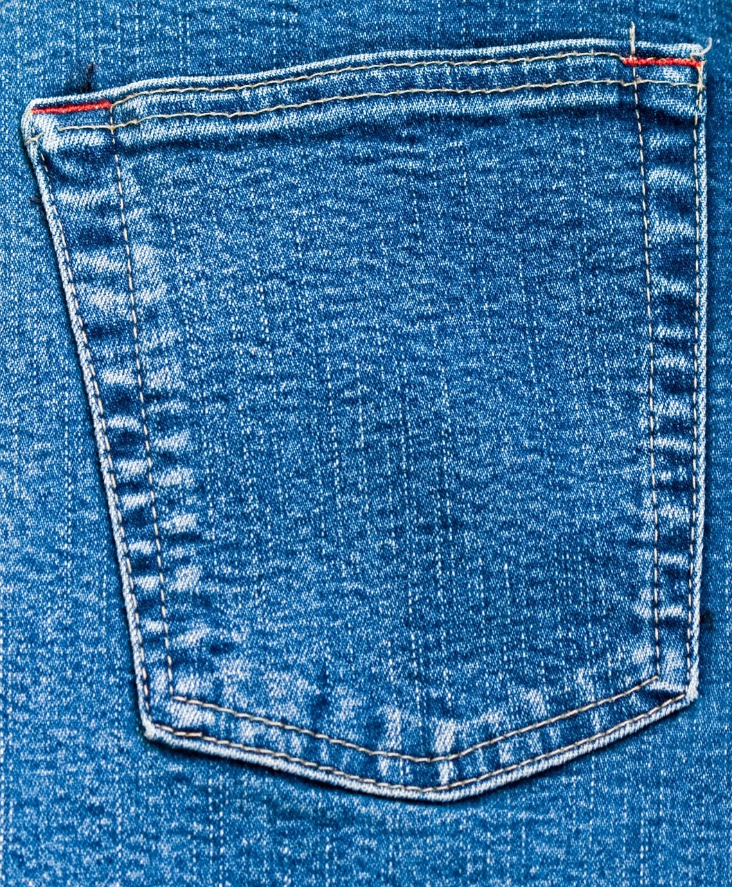 the back pocket of a pair of blue jeans, high detail product photo, high-resolution, zoomed, packshot