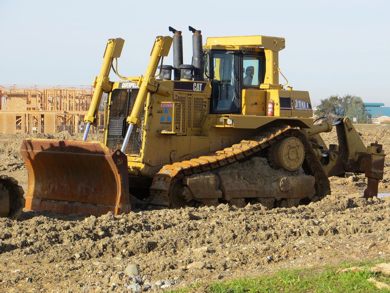 a bulldozer sitting on top of a pile of dirt, by Steven Belledin, flickr, chonker cat, lavs flowing through the land, california, emperor