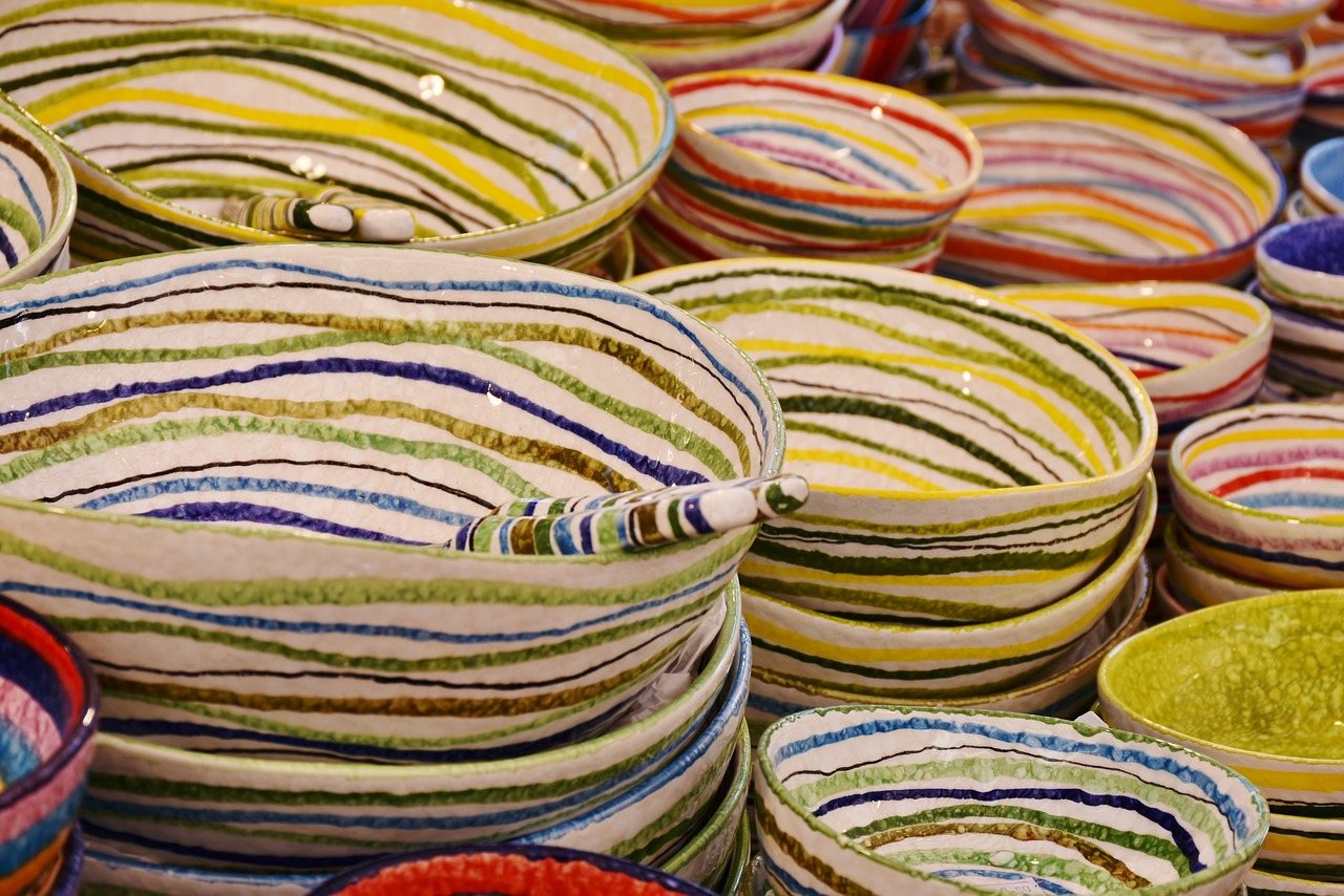 a pile of colorful bowls sitting on top of a table, a picture, inspired by Quirizio di Giovanni da Murano, pixabay, stripes, marble!! (eos 5ds r, inside an arabian market bazaar, plates