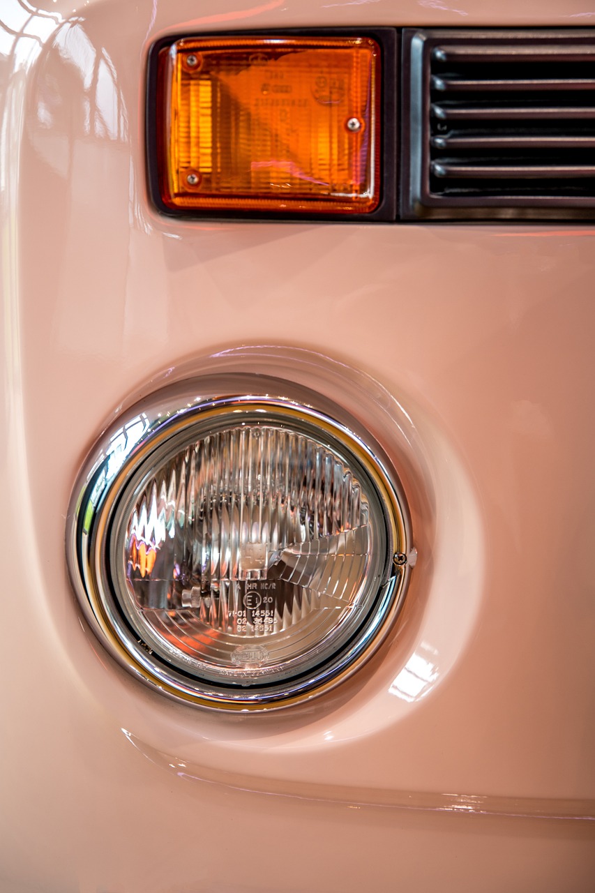 a close up of a light on a vehicle, a photo, kombi, with soft pink colors, professional closeup photo, high details photo