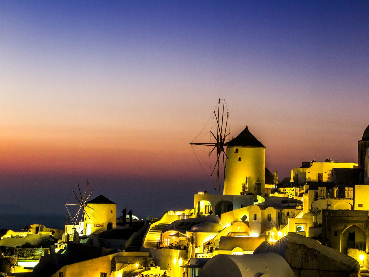 a couple of windmills sitting on top of a hill, a picture, by Alexis Grimou, beautifully lit buildings, greek setting, there is midnight sunset, you won't believe it