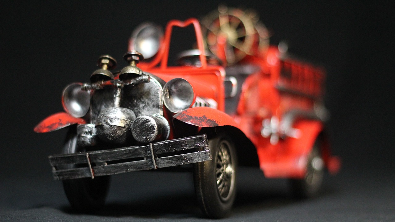 a toy truck with a teddy bear in the back, by Adam Rex, pexels contest winner, photorealism, a firetruck at night, antique piece, metal art, 1929