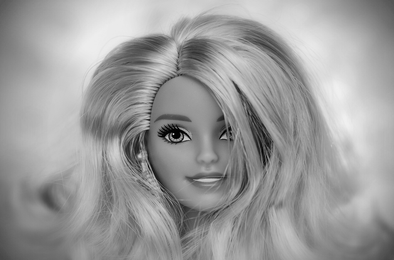 a black and white photo of a barbie doll, by Elaine Hamilton, pixabay, pop art, ash blond greyish hair, digital airbrush painting, having fun. vibrant, silky hair